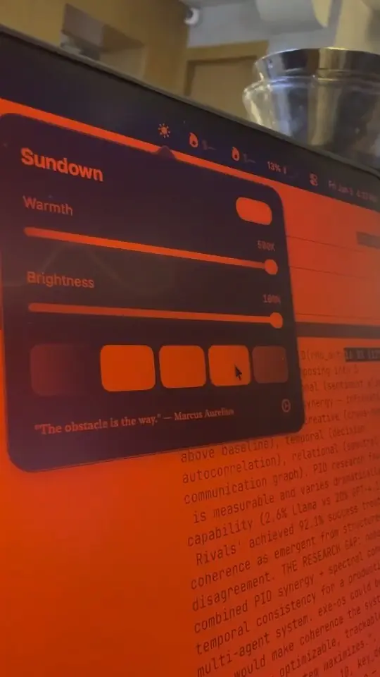 A photo of the Sundown panel on a MacBook in a dark room, with the screen warmed and dimmed